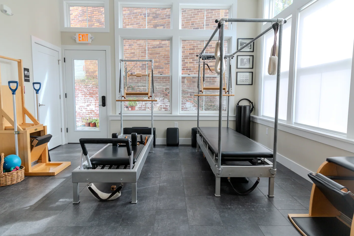 Reformer and Cadillac beside the windows in the Mello Pilates studio